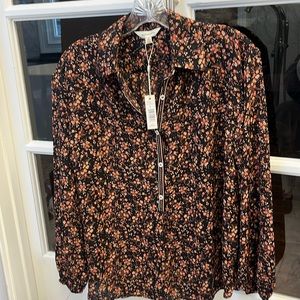 Brown tones in a 3/4 button down blouse